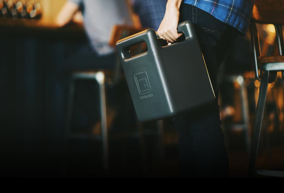 An Individual Filling Up A BrewQube